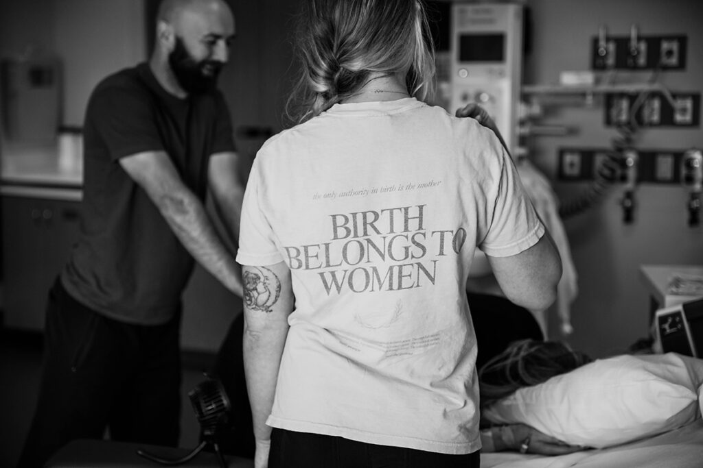 A birth doula comforts a family during a birth in Oklahoma City.